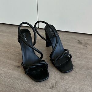 Black faux leather heels